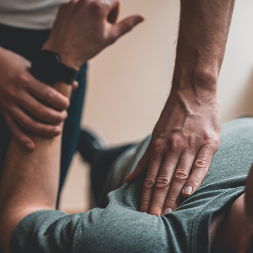 Physiotherapy A medical professional treating a patients shoulder