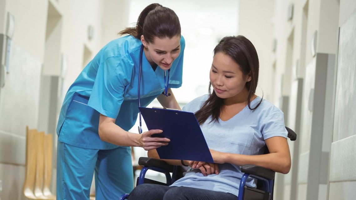 Nurse explaining care to patient