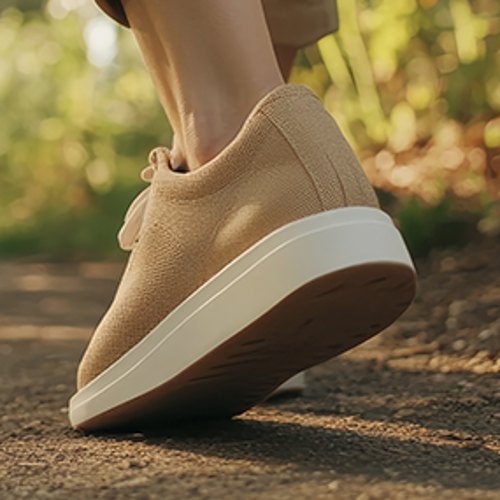 Podiatry The legs and feet of a person walking through a garden